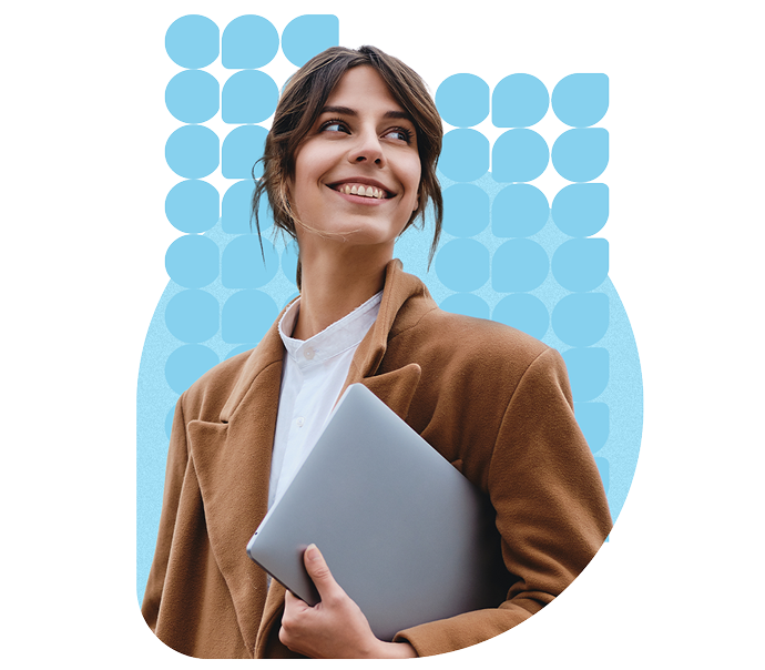 Accountant smiling, holding a laptop